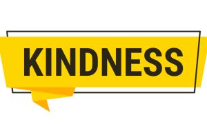 Illustration: bold yellow banner graphic with the word “KINDNESS” in black uppercase letters.